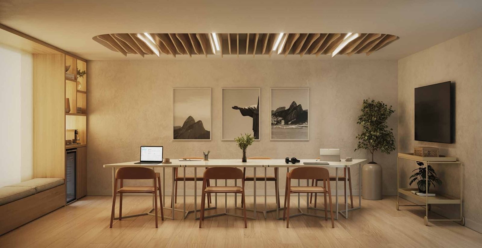 Coworking do Be.in.Rio Barão da Torre, com mesa compartilhada e televisão