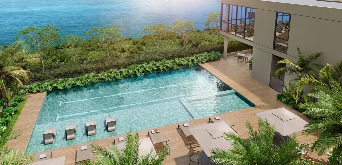 Vista aérea das piscinas adulto e infantil do Breeze Residence