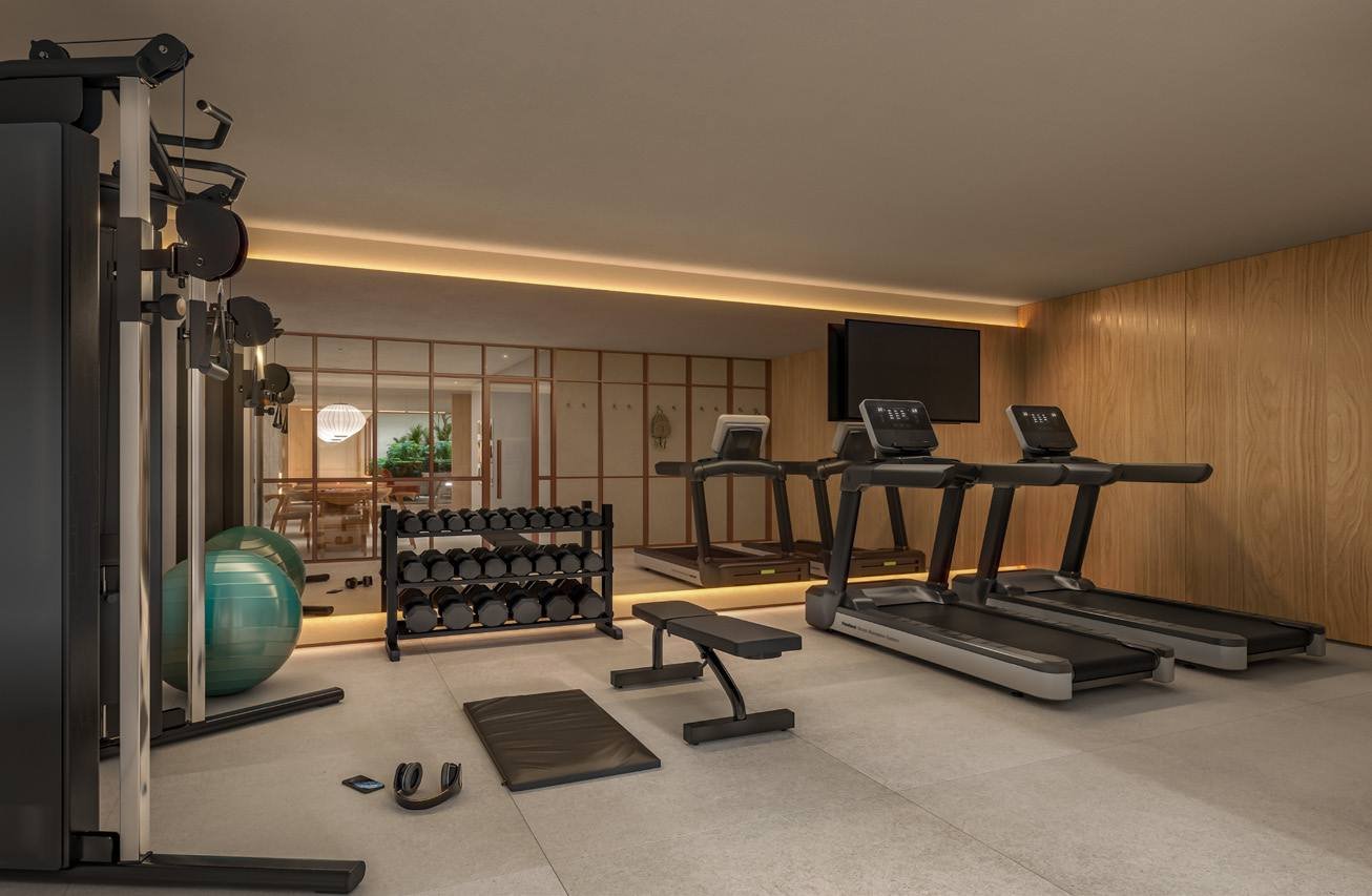 Espaço fitness do Bronze Ipanema Studios, com esteira, bicicleta e equipamentos de musculação