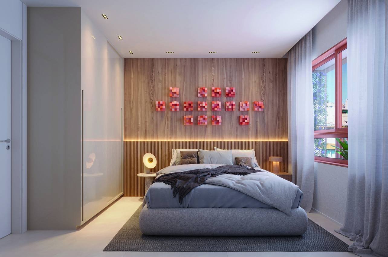 Suíte do Bronze Ipanema Studios, com cama, painel de madeira e iluminação indireta