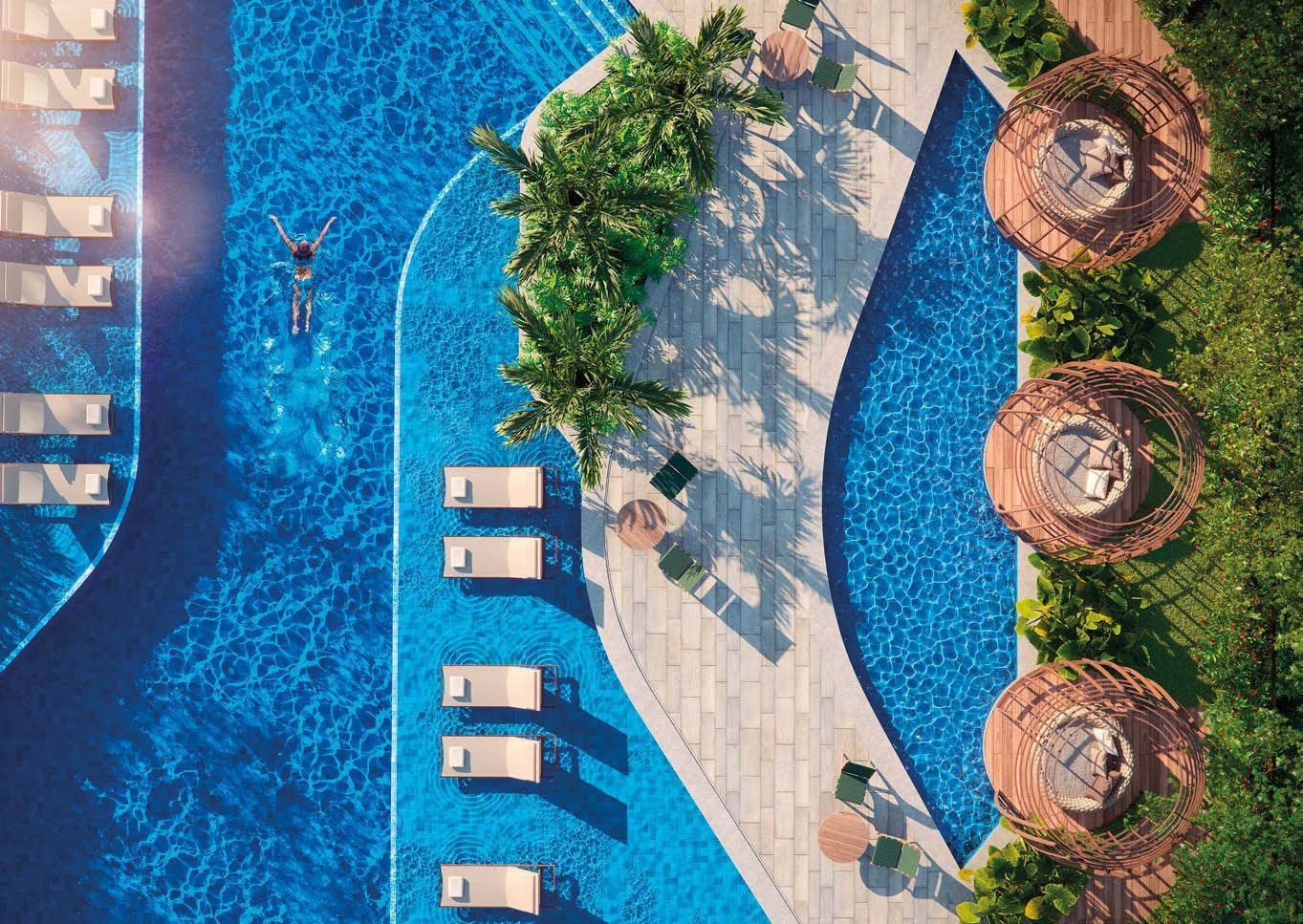 Vista aérea da piscina do Gaea Home Resort, com cabanas e vegetação tropical