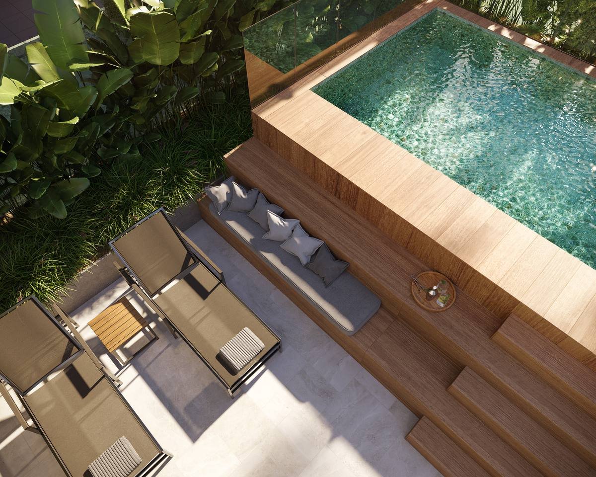 Espreguiçadeiras no deck da piscina do Grand Quartier Rio 2