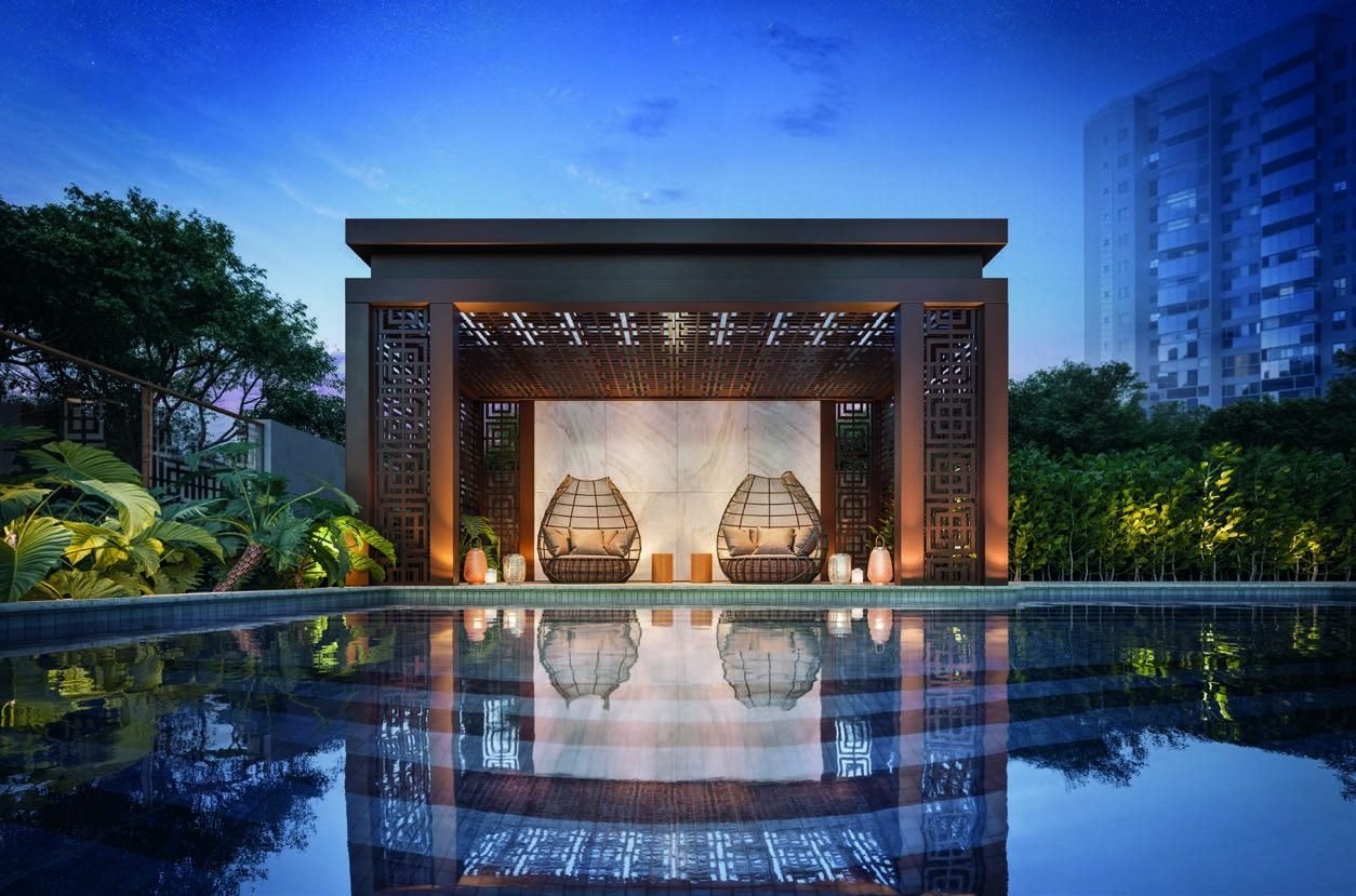Lótus Bar do Gran Thai, iluminado à noite e cercado de água