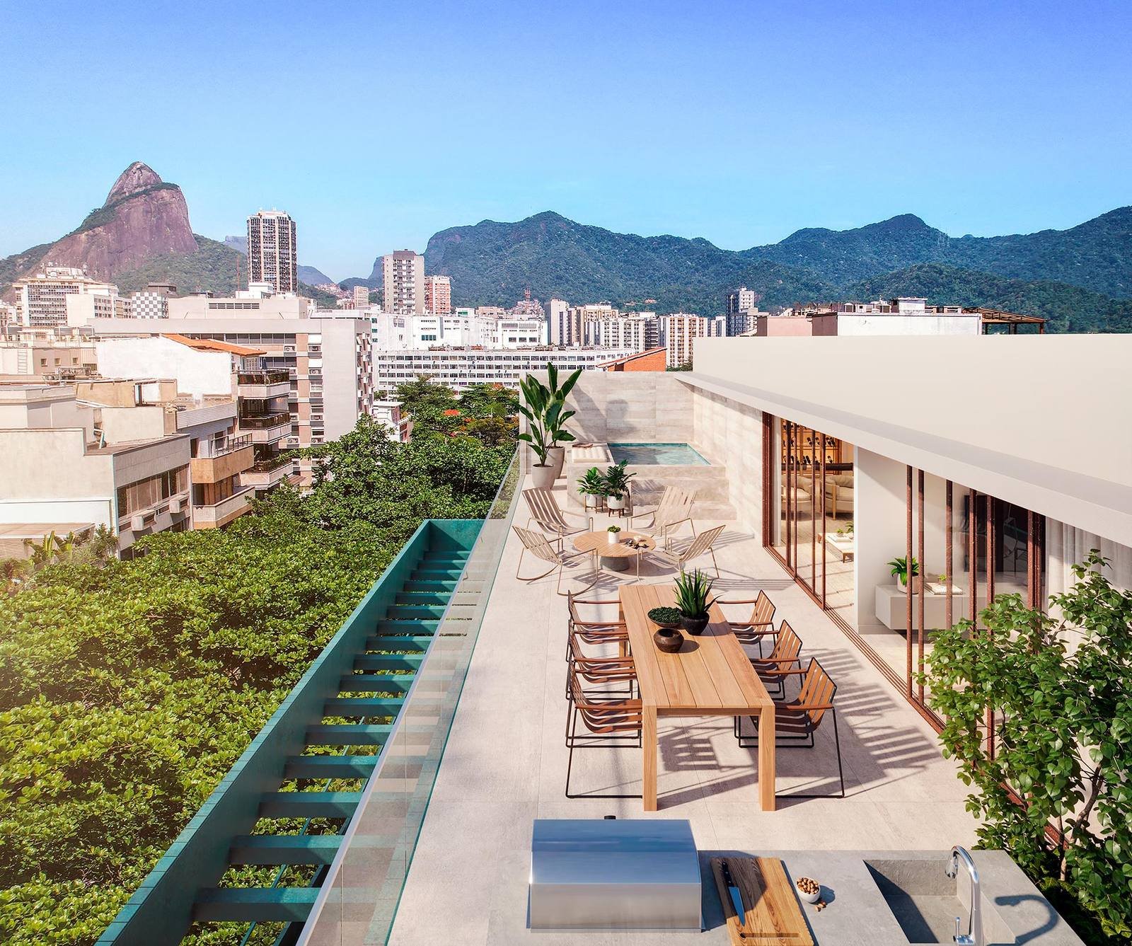 Terraço da cobertura do Tempo Ipanema, com piscina, deck e vista para o Morro Dois Irmãos